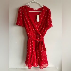 Red and white polka dot flowy dress from Francesca’s. Size medium. New with tags